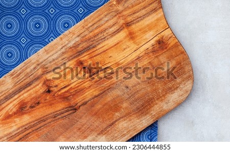 Background of gray with rustic worn wood and traditional South African cloth