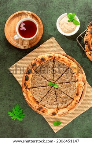 Syrian pie pizza with minced meat, tomato sauce and pomegranate molasses 2
