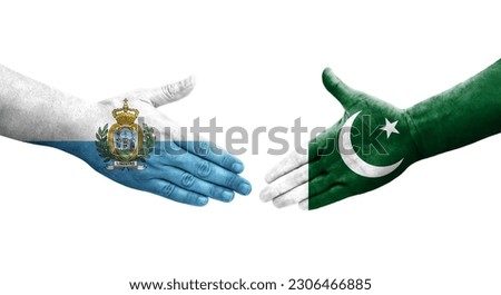 Handshake between Pakistan and San Marino flags painted on hands, isolated transparent image.