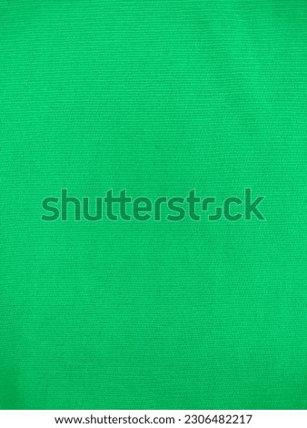 The texture of Fabric Cloth, linen or canvas fabric in green, Green Color Cloth Background.