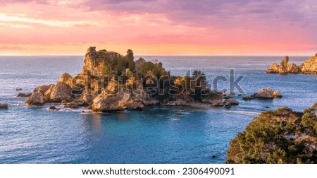 travel landscape of beautiful isle among blue sea waves with golden coast with beach and colorful cloudy sky on background 