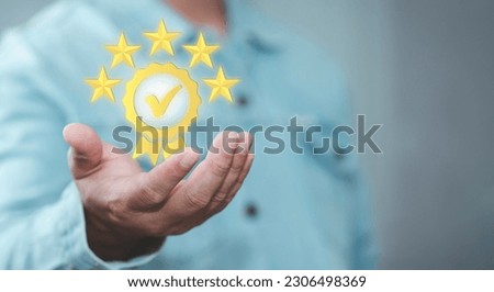 Hand shows the sign of the top service Quality assurance. ISO certification and standardization concept, Guarantee, Standards, satisfaction, trust client, service experience,