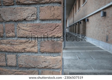 The imposing brick walls stand tall, their intricate construction details a testament to the architect's skill,can be used for stock backgrounds, templates and wallpapers