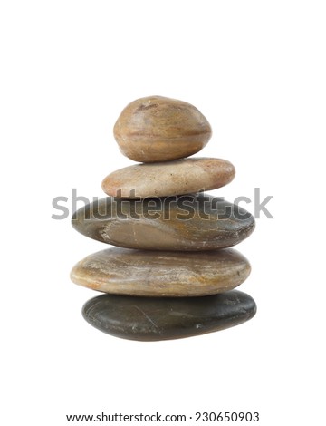 Balanced zen stones in pyramid isolated on white background. Harmony, healthcare and spa concept Royalty-Free Stock Photo #230650903