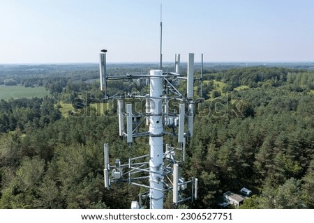 A stunning aerial view captured by drone showcases a GSM pole, highlighting its structure, height, signal transmission capabilities, and surrounding landscape