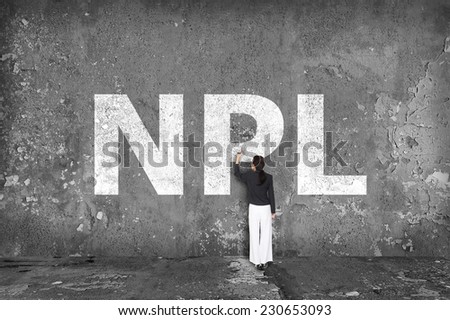 businesswoman drawing NPL on the wall