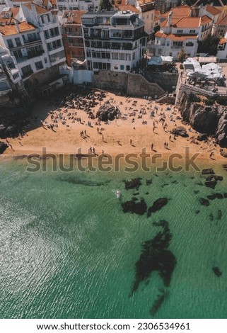 Drone aerial view of Praia da Rainha and Conceicao next to the historic city centre of Cascais, Portugal Royalty-Free Stock Photo #2306534961