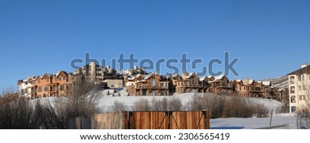 Townhouses and condos in winter snow,  Steamboat Springs,  Colorado                          Royalty-Free Stock Photo #2306565419