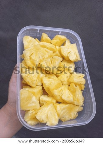 Pineapple Slices Or Nanas Potong with yellow color, fresh, and sweet pinneaple images | Stock Photos