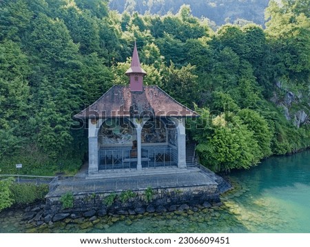 Famous Tell's Chapel at lakeshore of Lake Uri on a sunny spring day. Photo taken May 22nd, 2023, Sisikon, Canton Uri Switzerland.