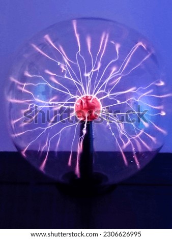 Tesla plasma ball with light beams inside, lightning effect