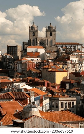 A vertical aerial shot of the Porto Cathedral and the rooftops of the Se area in Porto, Portugal