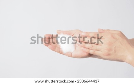 Hands washing gesture and foam hand soap on white background.