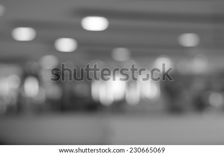 Department store blurred background with bokeh,defocused light in department store,gray abstract background. 