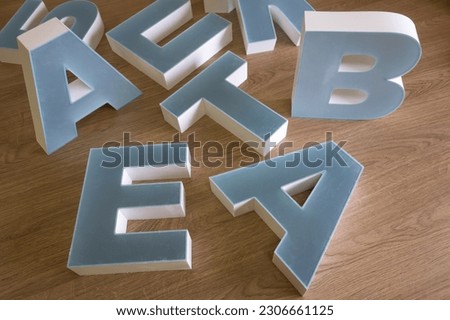 Plastic covers for outdoor advertising logo.Production of the store's inscription for advertising purposes.