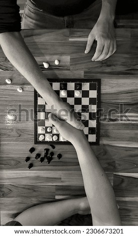 handshake of two chess players after finishing a game