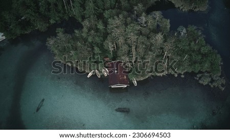 Lost cabin at the lake from aerial perspective