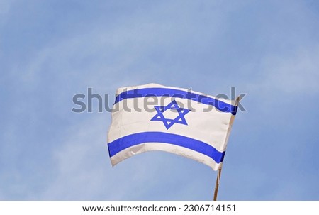 75 years since the founding of the State of Israel.
Flag of Israel. State symbol.
Flag of Israel on the background of the Wailing Wall. Royalty-Free Stock Photo #2306714151