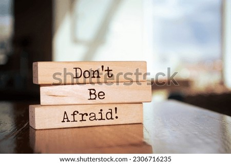 Wooden blocks with words 'Don't Be Afraid'.