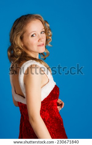 charming blonde woman in red dress  on blue background