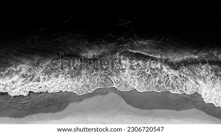 Coast with waves as a background from top view. Black white water background from drone. Summer seascape from air. Travel - image Royalty-Free Stock Photo #2306720547