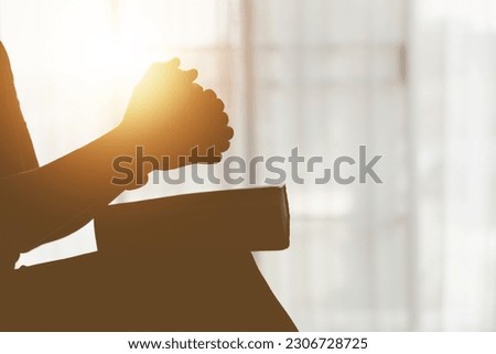 Christian life crisis prayer to god. Woman Pray for god blessing to wishing have a better life. woman hands praying to god with the bible. begging for forgiveness and believe in goodness. Royalty-Free Stock Photo #2306728725