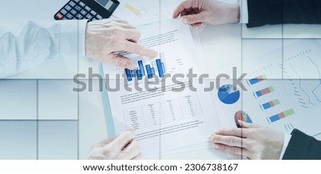 Businesspeople having a discussion about financial report at office, geometric pattern
