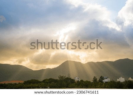 Calm sea with sunset sky and sun through the clouds over Con Dao Island. Calm sea with sunset sky and sun through the clouds over. Meditation ocean and sky background. Tranquil seascape.