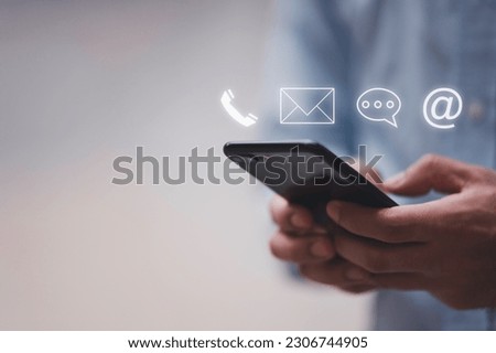 Businessman using Smart Phone with the email, call phone, address, Chat message icons.Customer support hotline Contact us people connection. Royalty-Free Stock Photo #2306744905