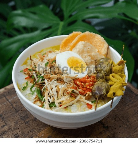 Indonesian food is usually called chicken porridge (Bubur Ayam), various kinds of side dishes combined with soft rice porridge Royalty-Free Stock Photo #2306754711