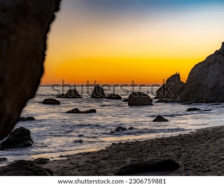 Sunset by the ocean at El Matador Beach, Malibu, California Royalty-Free Stock Photo #2306759881