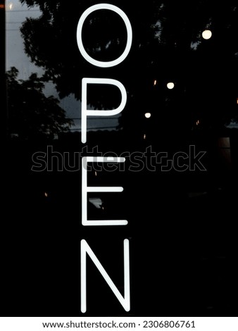 Neon Open Sign in Store Window