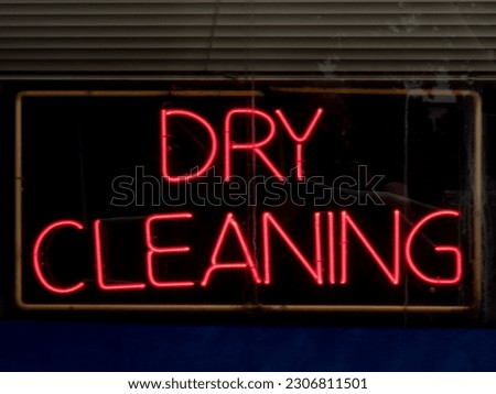 Neon Dry Cleaning Sign in a Store window