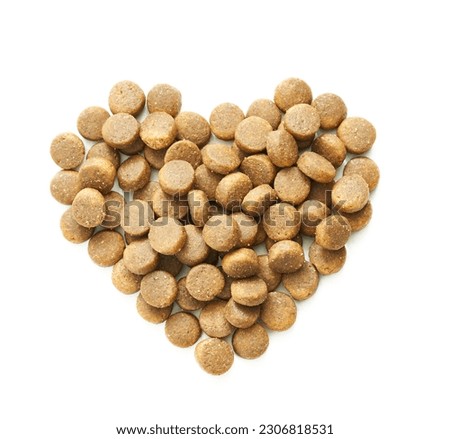 top view overhead pet dog cat food kibble feed pellet heart shape isolated on white background. pet dog cat food kibble feed pellet heart shape isolated. pet pellet heart shape Royalty-Free Stock Photo #2306818531