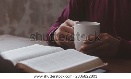 Believers are reading the Holy Bible every day and every time in a private room. The idea of ​​studying more about God through the Bible. Royalty-Free Stock Photo #2306822801