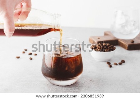 Iced Coffee, Cold Brew Coffee with Ice on Bright Light Grey Background, Refreshing Beverage Royalty-Free Stock Photo #2306851939