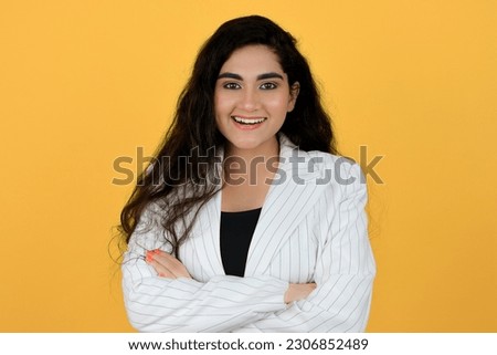 Happy Young Indian Girl Smiling Standing with Arms Crossed - Face Expression