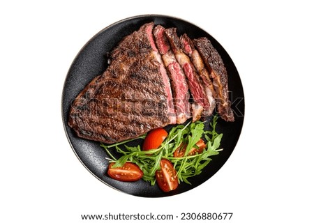 Barbecue grilled and sliced wagyu Rib Eye beef meat steak on a plate. Isolated on white background Royalty-Free Stock Photo #2306880677