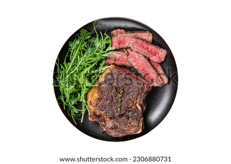 BBQ Grilled Wagyu New York beef meat steak or Striploin steak in a plate with salad. Isolated on white background Royalty-Free Stock Photo #2306880731