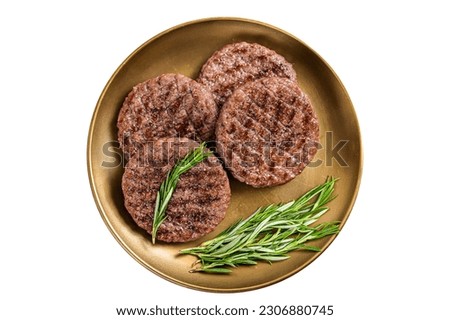 Grilled burger beef meat patty with herbs and spices on steel plate. Isolated on white background