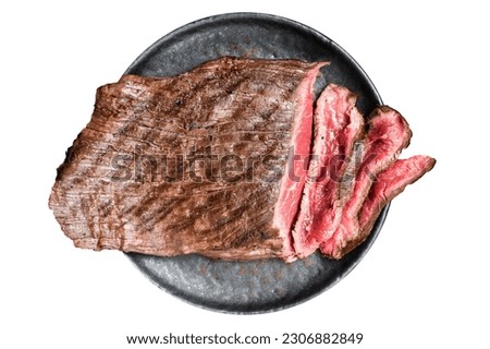 Grilled Flap or Flank Steak, sliced on a plate. Isolated on white background Royalty-Free Stock Photo #2306882849