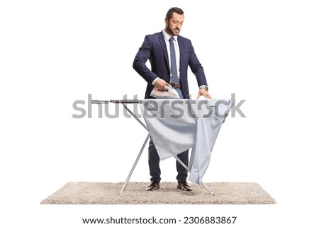 Businessman ironing a shirt isolated on white background
