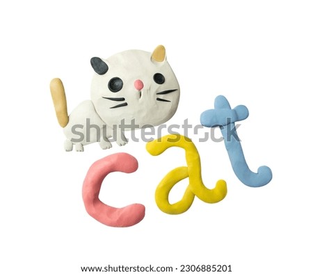Handmade cartoon cat. Lettering modeling clay cat.