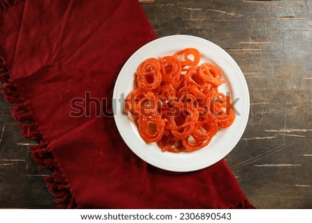 Jalebi or Jilapi served in plate isolated on mat top view of indian, bangali and pakistani dessert mithai Royalty-Free Stock Photo #2306890543