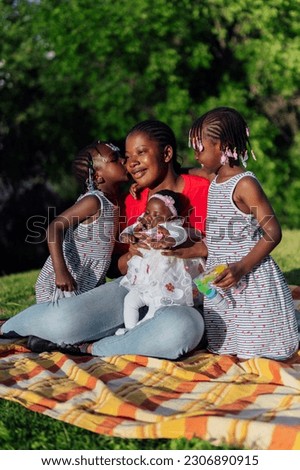 African family kissing in the park