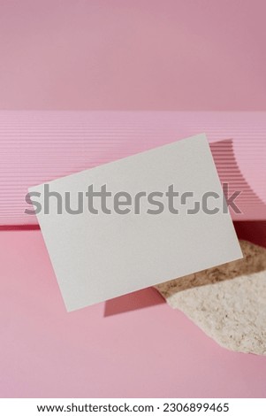 Folded woman glitter business card mock up on pink background. Menu vertical mock up