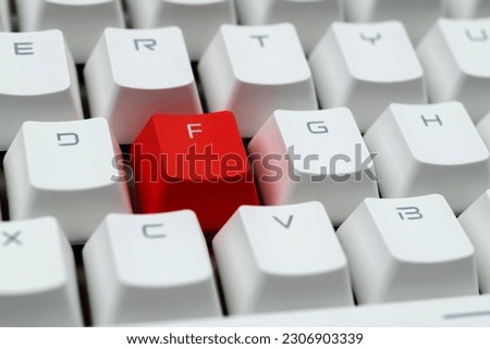 Modern keyboard with red letter f button