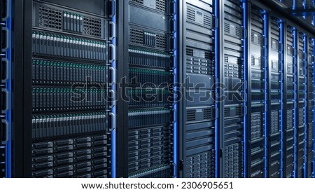 Server Racks and Cabinets full of Hard Drives inside Large Data Center. Advanced Cloud Computing Concept. Royalty-Free Stock Photo #2306905651
