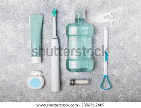 Bathroom with sonic electric toothbrush, toothpaste, mouthwash, dental floss and tongue cleaner . Oral hygiene. Dental care.Dentistry concept.Place for text.Place for copy.MOCKUP