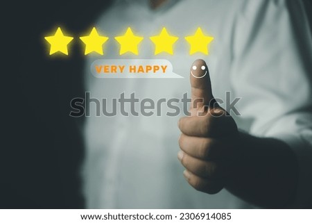 Customer experience satisfaction concept. Customer hand with thumb up positive emotion smiley face icon and five star with copy space. Best excellent services rating for satisfaction.